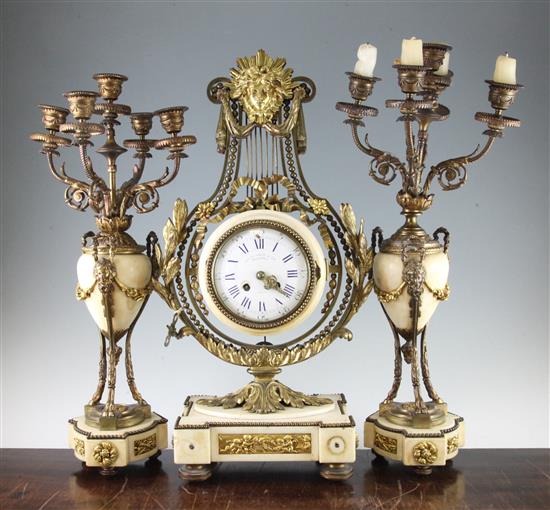 A 19th century French ormolu mounted white marble clock garniture, 21in.